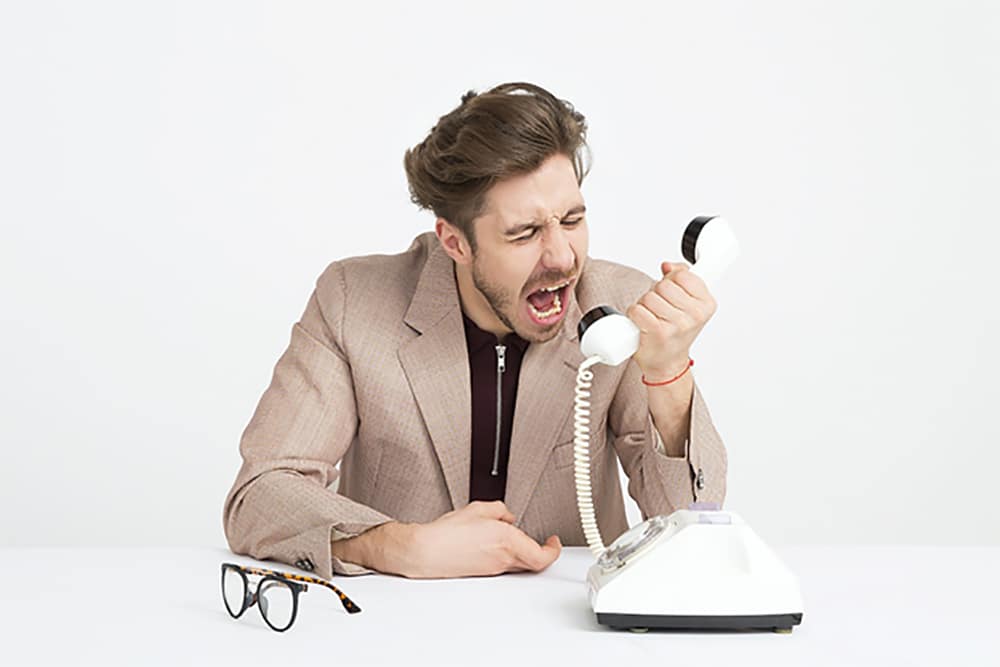 Man shouting on telephone